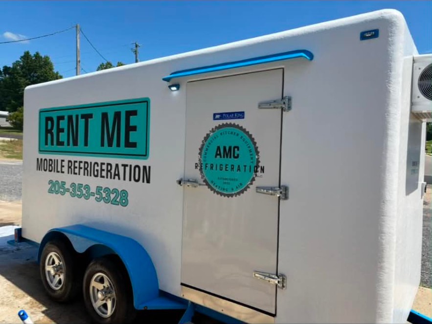 Rear view of the AMC Refrigeration rental trailer showing the sealed cooler door