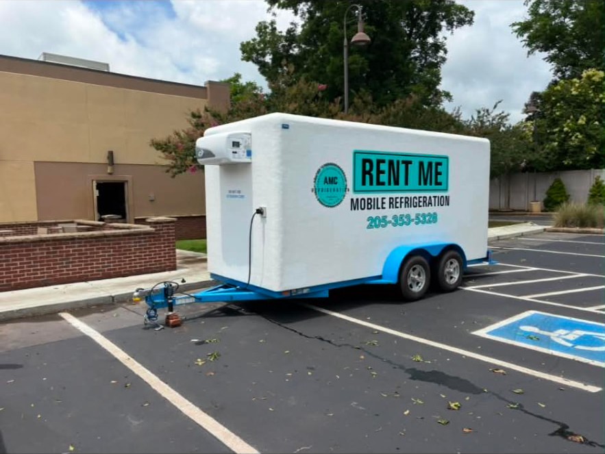 AMC mobile refrigeration trailer parked and plugged in at a commercial lot